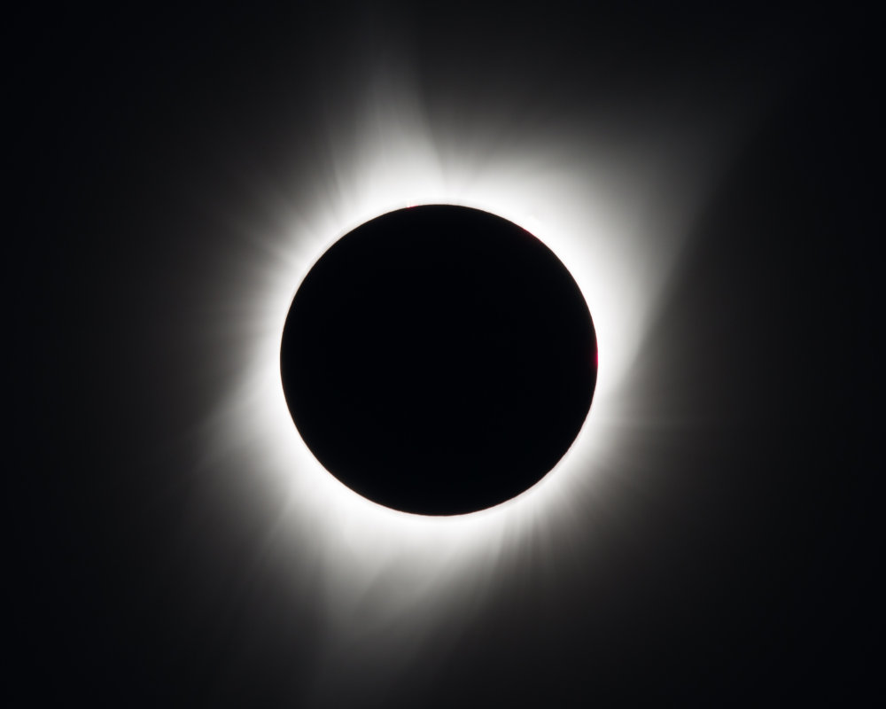 2017 Total Solar Eclipse A total solar eclipse is seen on Monday, August 21, 2017 above Madras, Oregon. A total solar eclipse swept across a narrow portion of the contiguous United States from Lincoln Beach, Oregon to Charleston, South Carolina. A partial solar eclipse was visible across the entire North American continent along with parts of South America, Africa, and Europe. Photo Credit: (NASA/Aubrey Gemignani)